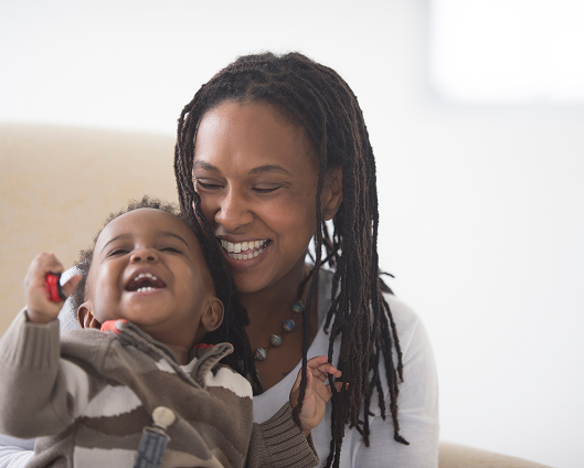 A mother sharing family time with her child.