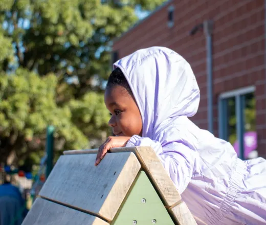 preschool student explores the Hilltop YMCA's Nature Playscape for the first time