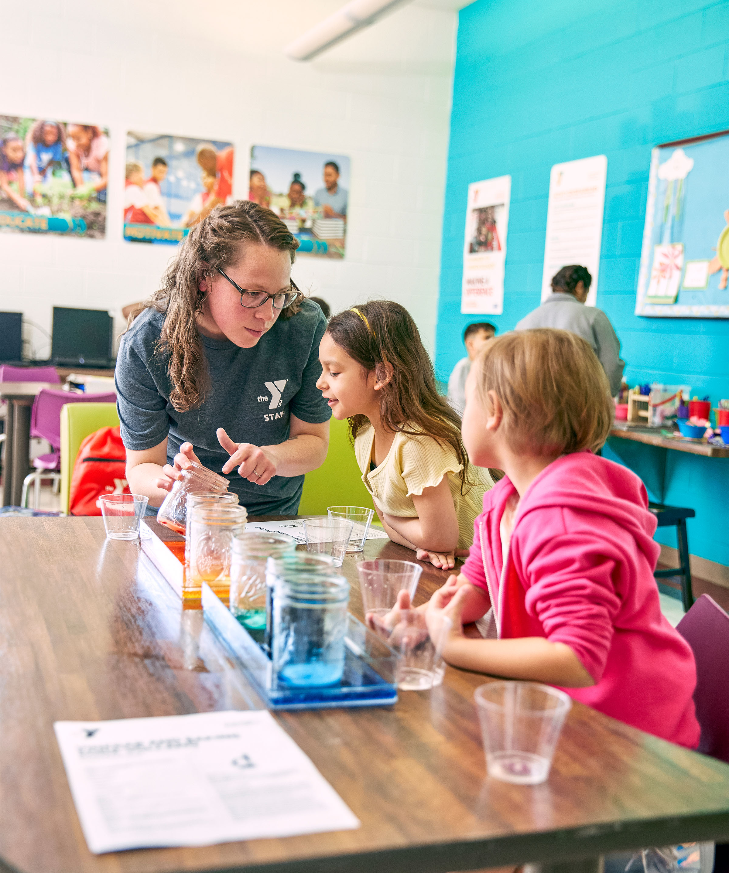 Teacher and children with science activity