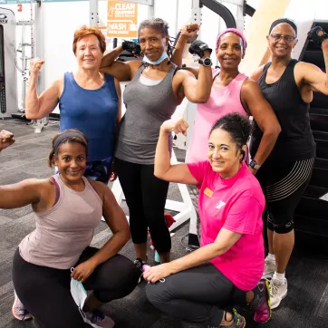A group of women flexing after a workout