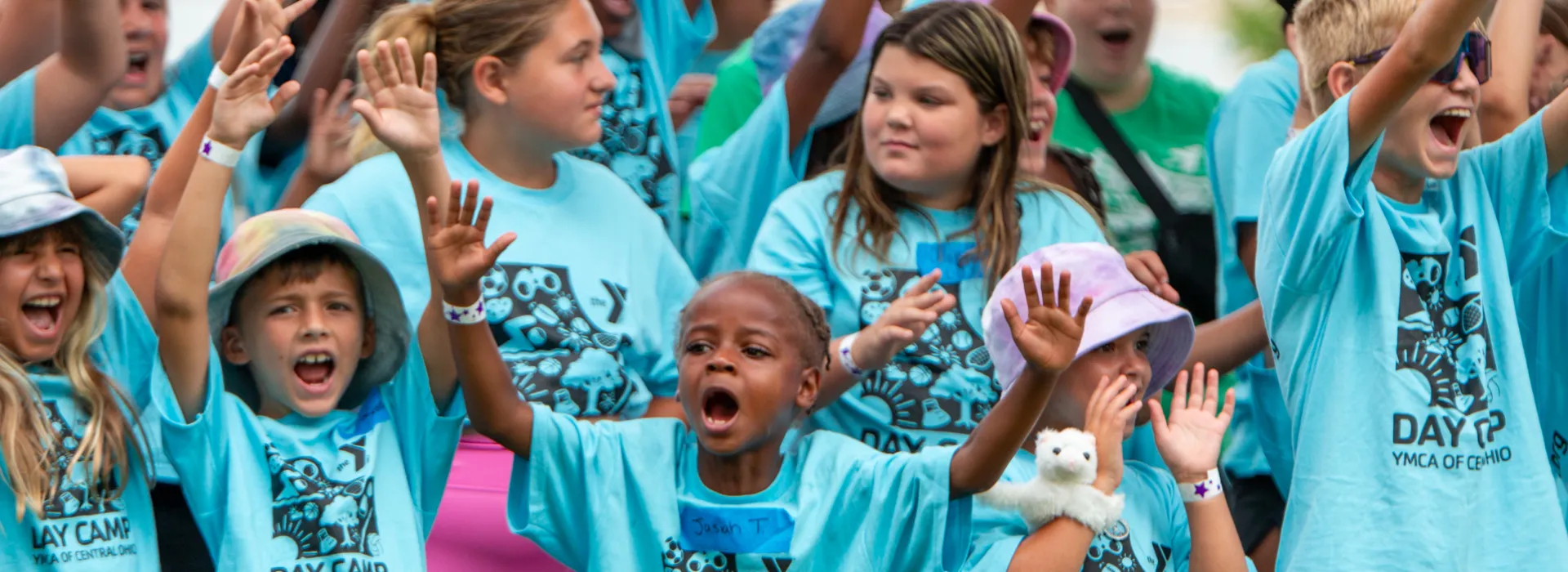 A group of youth celebrating their team at Spirit Day