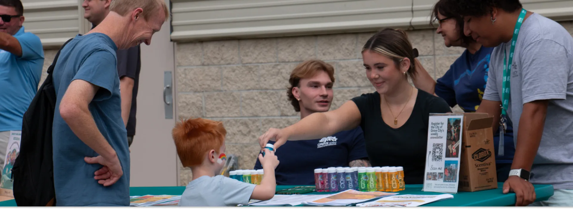 Grove City Family Fun boy getting sample from a staff member