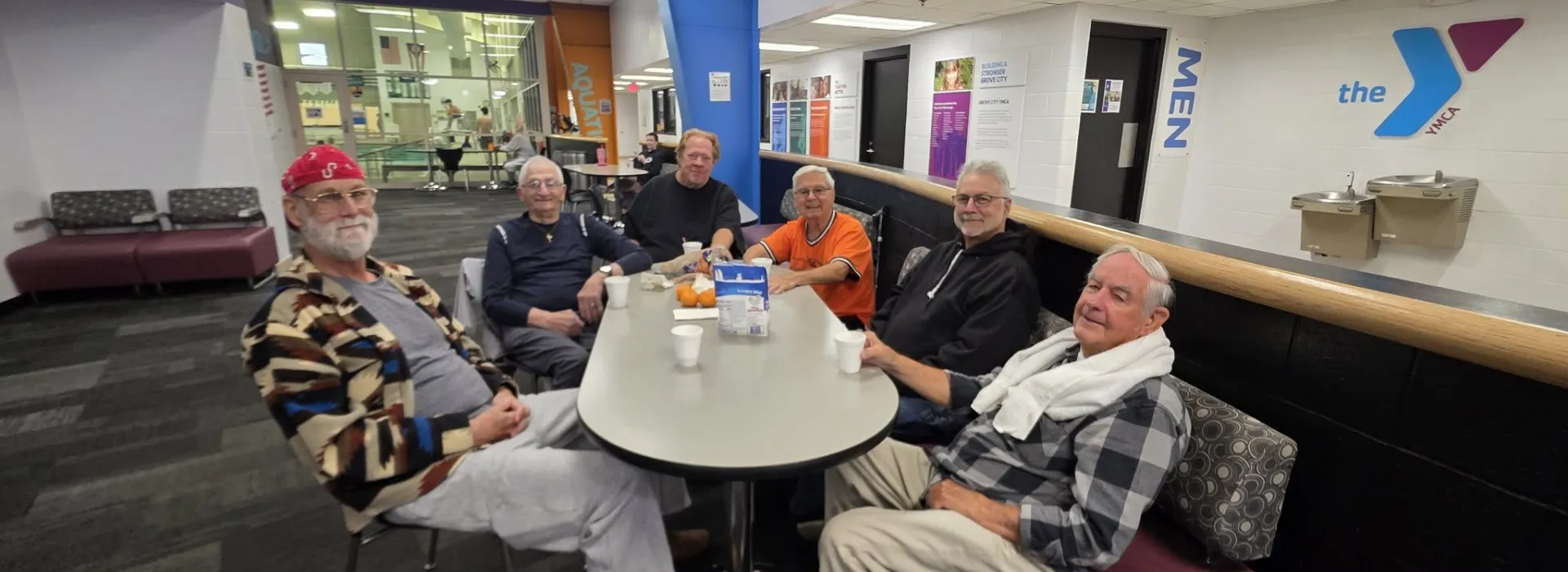 Group of Men enjoying time together at the YMCA Gym